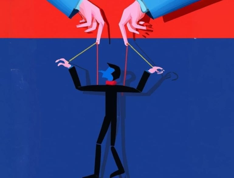 This shows hands controlling a puppet