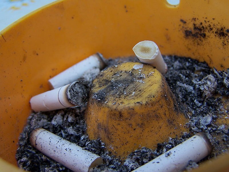 The image shows a full ashtray.