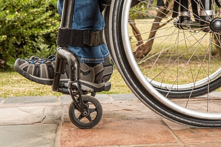 This shows a person's feet in a wheelchair