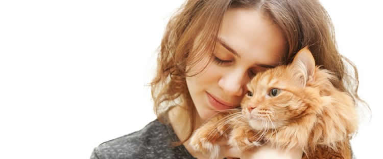 Photo of a young woman and a kitten.