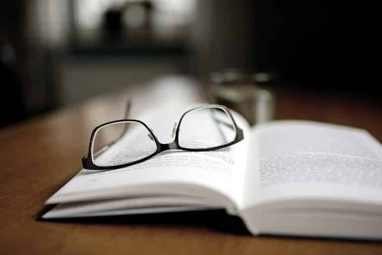 This shows a pair of glasses on a book