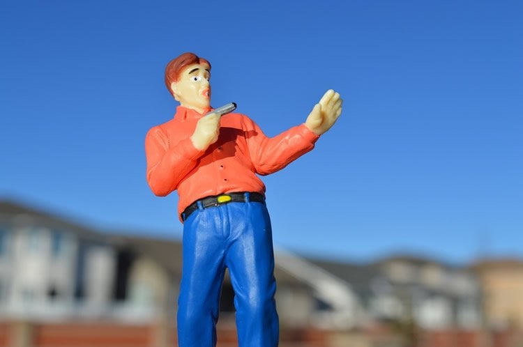 Image shows a plastic model of a man holding a gun.