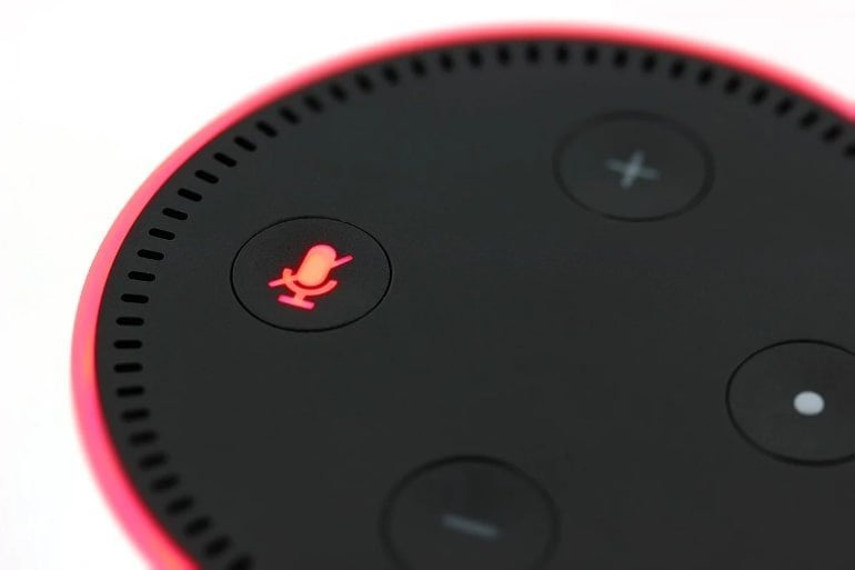This shows an Amazon Alexa echo dot with its mute button on
