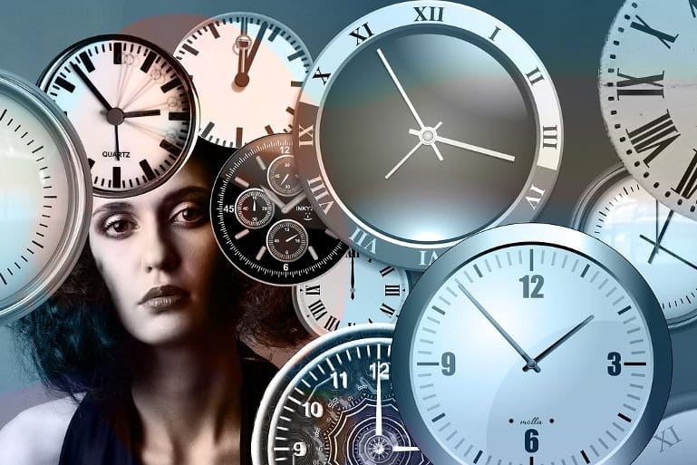 This shows a woman surrounded by clocks